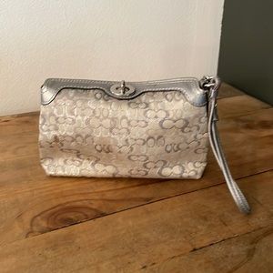COACH- Metallic Silver Monogram Wristlet/Clutch